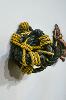 Knot of green rope accented with yellow rope. Found Object 