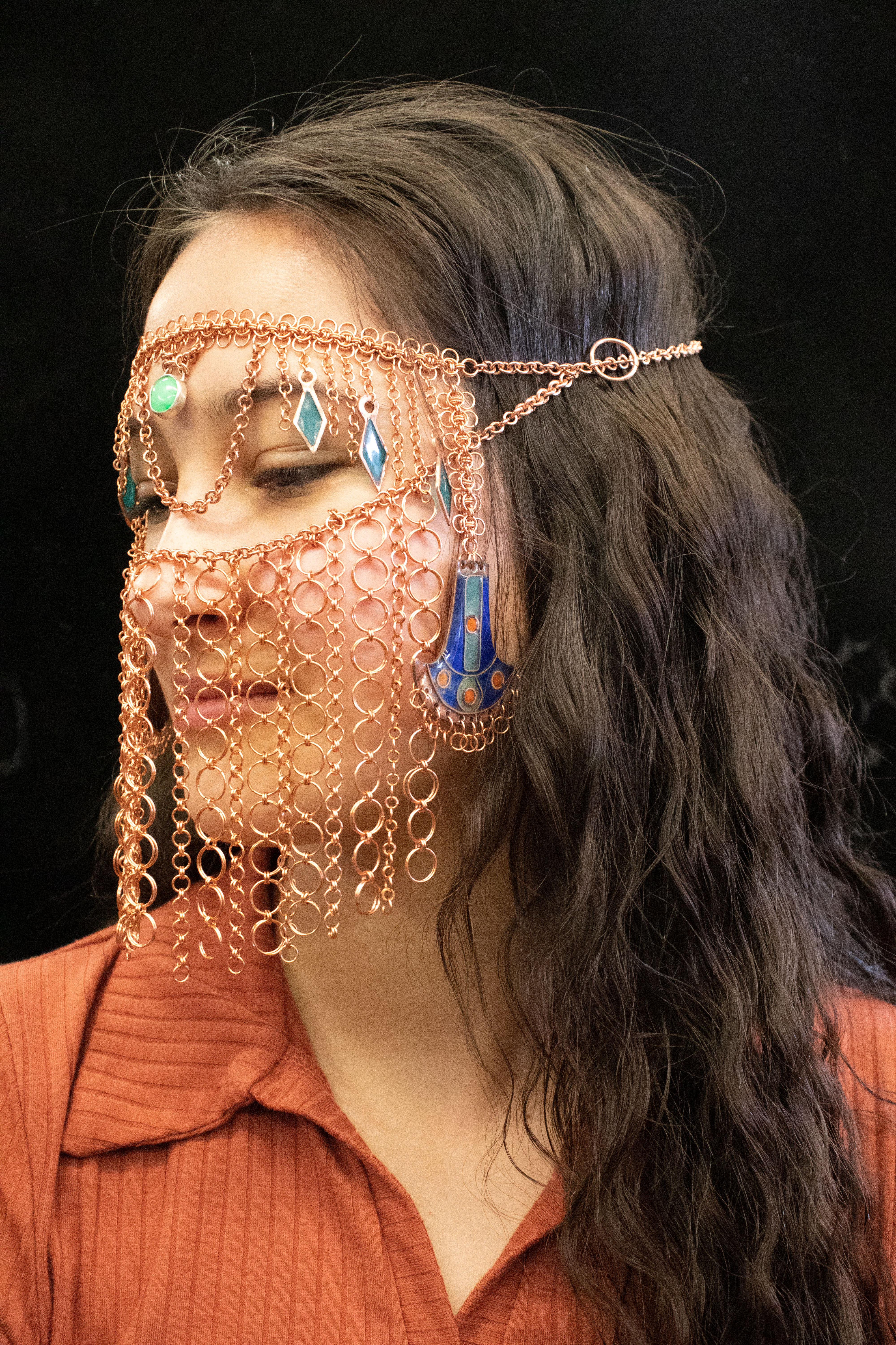 Ringed jewelry adorns a womans face 