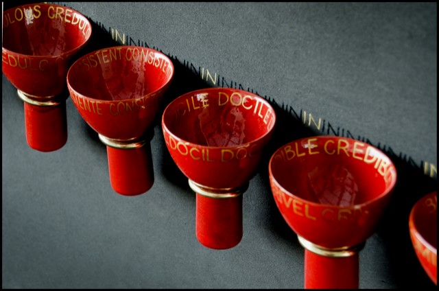 Red ceramc cups with golden lettering 